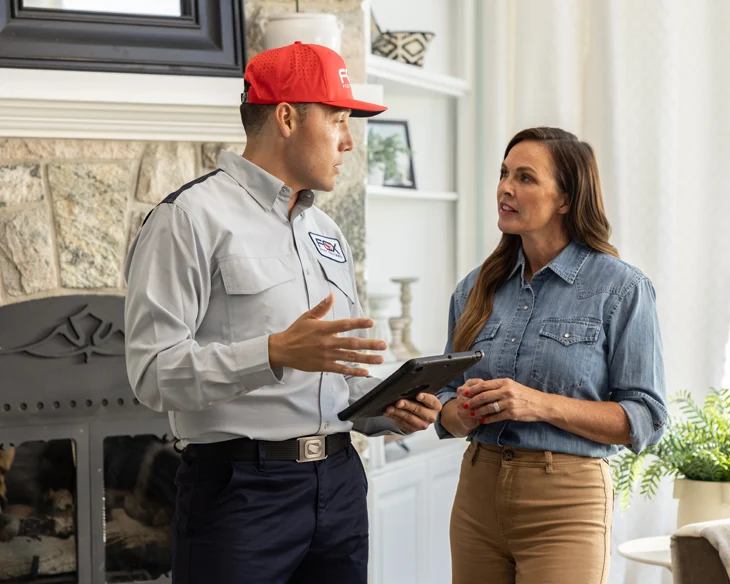 Pest control technician and customer